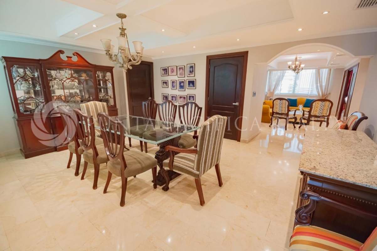Luxury dining area with marble floor, adjacent sitting area PH Bahia Esmeralda Panama