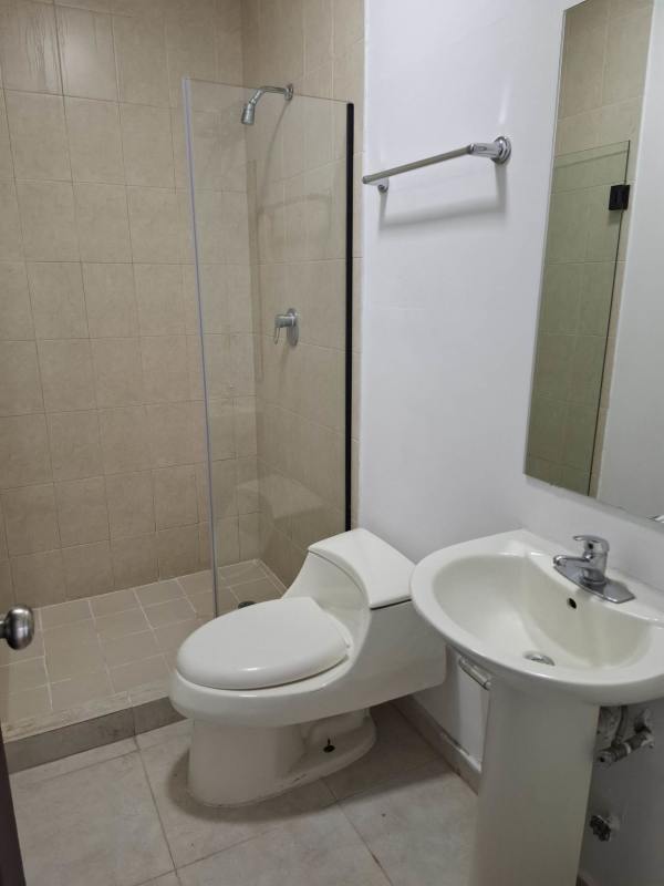 Bright bedroom with city view window, built-in wardrobe, AC at Sea Waves Tower Panama City