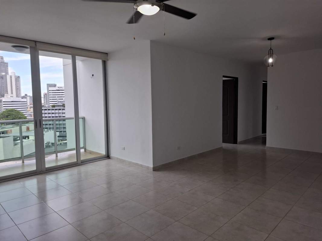Modern apartment living room with large balcony overlooking Panama skyline in PH Sea Waves Obarrio