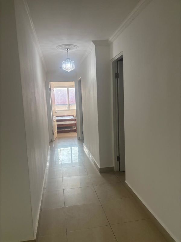 Bedroom with mint green walls, tile floors and ensuite bathroom, PH Sun City Albrook Panama