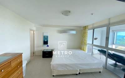Master bedroom with sliding doors to balcony and ocean views at Coronado Bay Panama