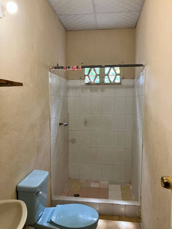 Basic tiled kitchen area with stainless sink and traditional cabinetry Pedregal property