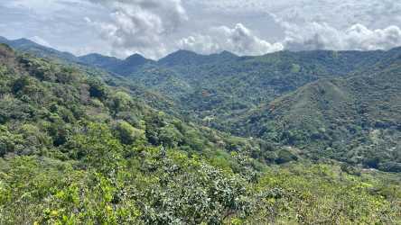 Expansive lush mountain valley landscape at El Copé eco land Panama