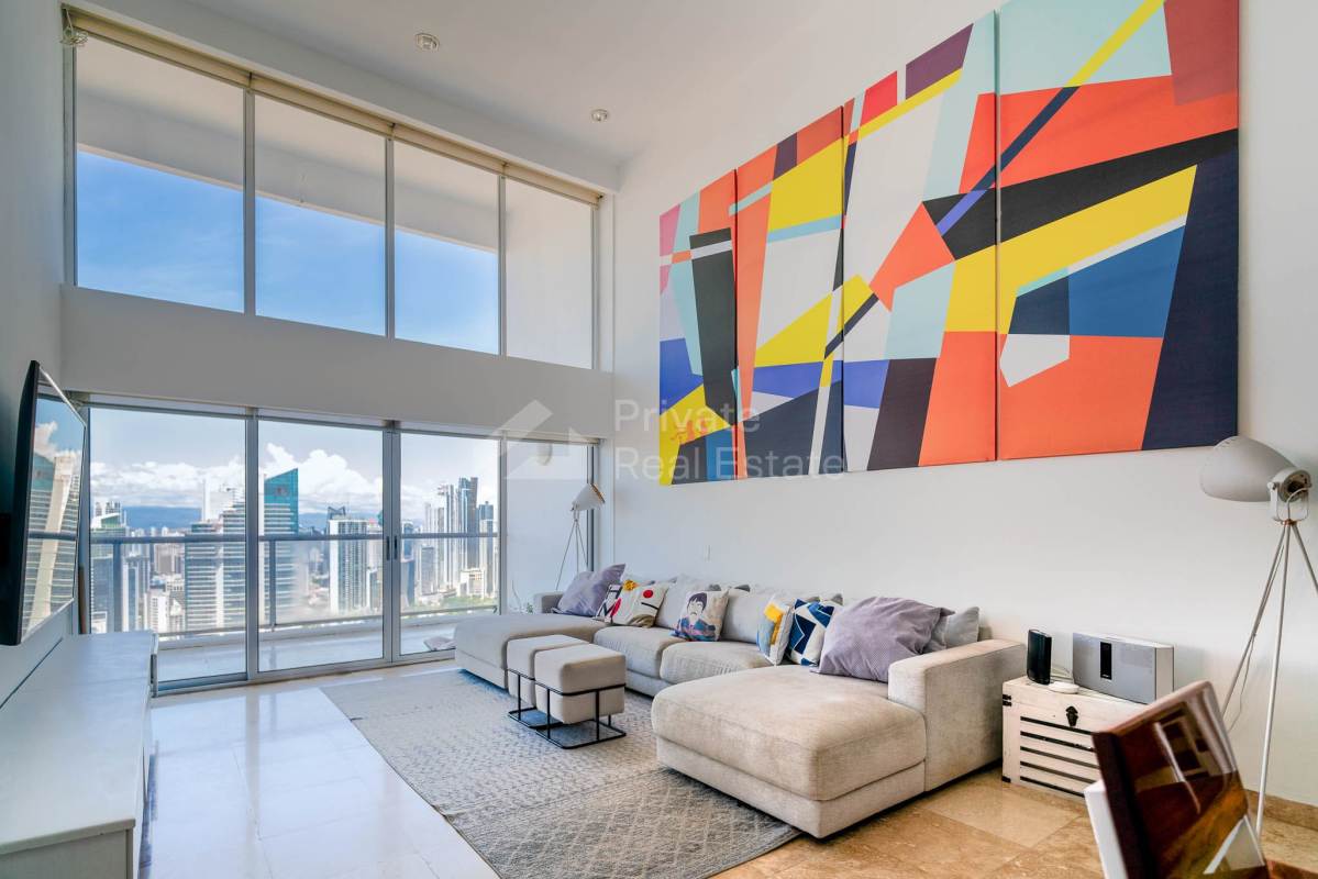 Open concept living with double height glass and city views PH Destiny Panama