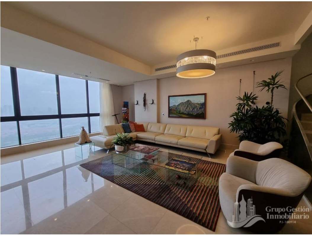 Large gourmet kitchen with marble countertops, island and luxury appliances in smart penthouse Santa María Panama