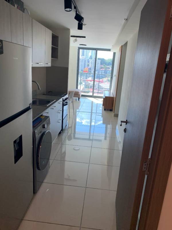 Bright open plan kitchen and living area with views in PH Epoca Panama City