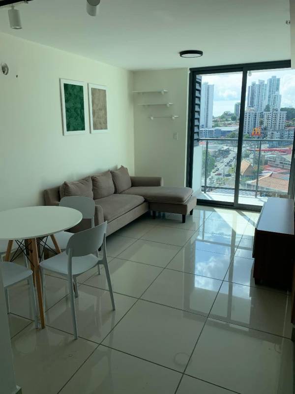 Living room with city view and modern decor in PH Epoca on Vía España Panama