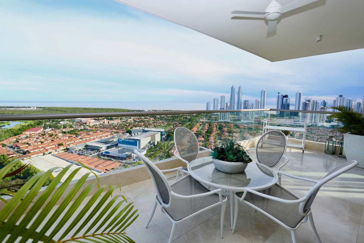 Large terrace balcony overlooking golf course and skyline with outdoor furniture PH GreenGarden Santa María Panama City