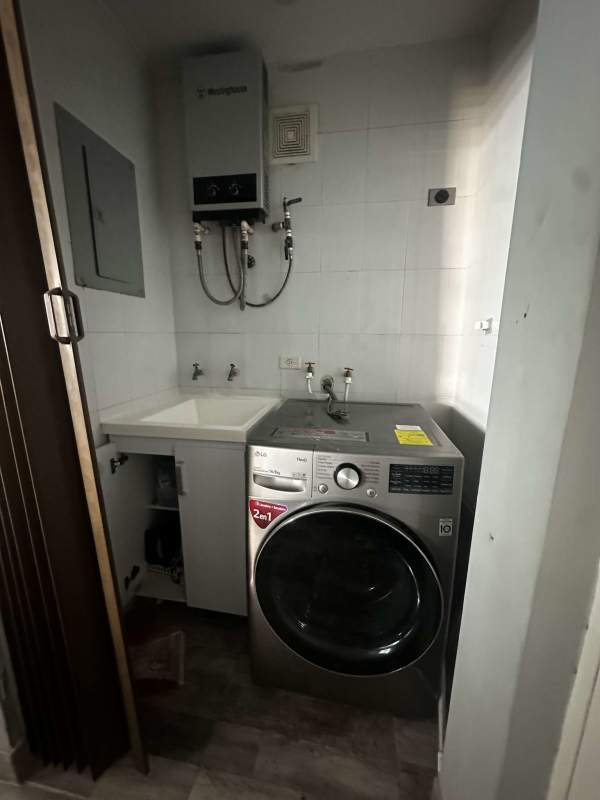 Kitchen with granite countertops, cabinetry, laundry sink in PH Oceania Edison Park Panama