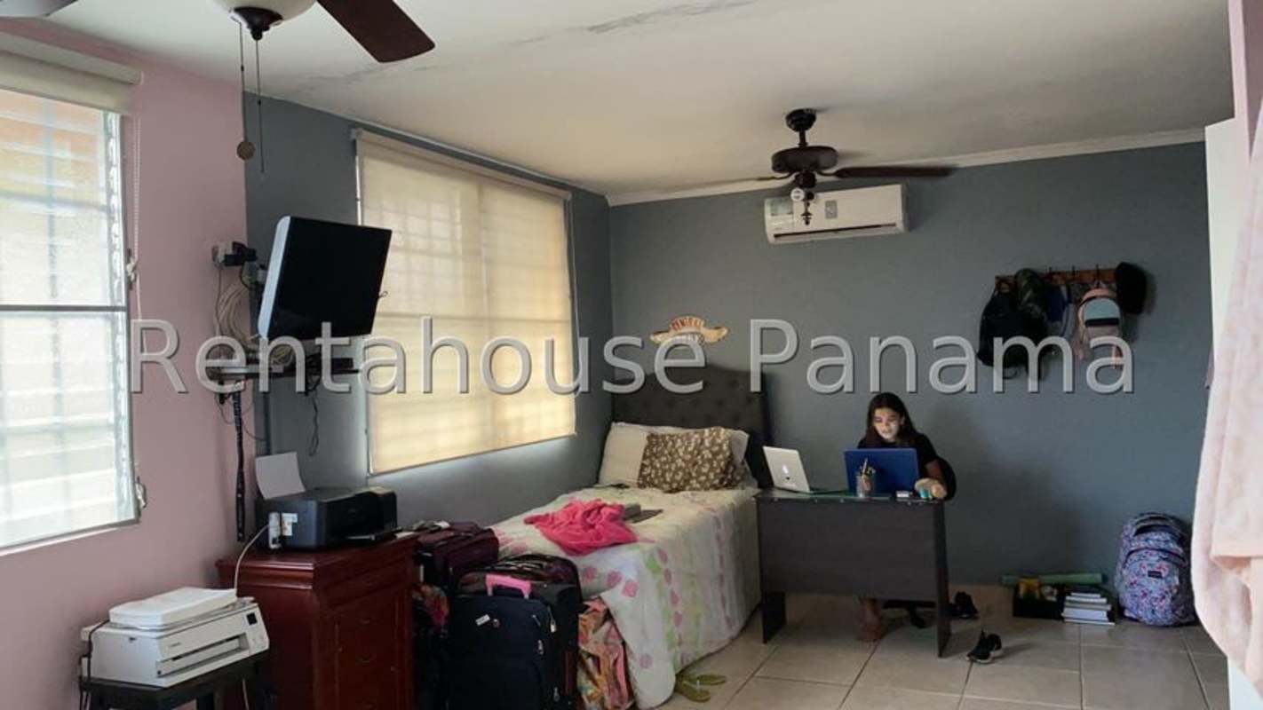 Large kitchen with granite countertop, storage cabinets in family house Brisas del Golf Occidente Panama City