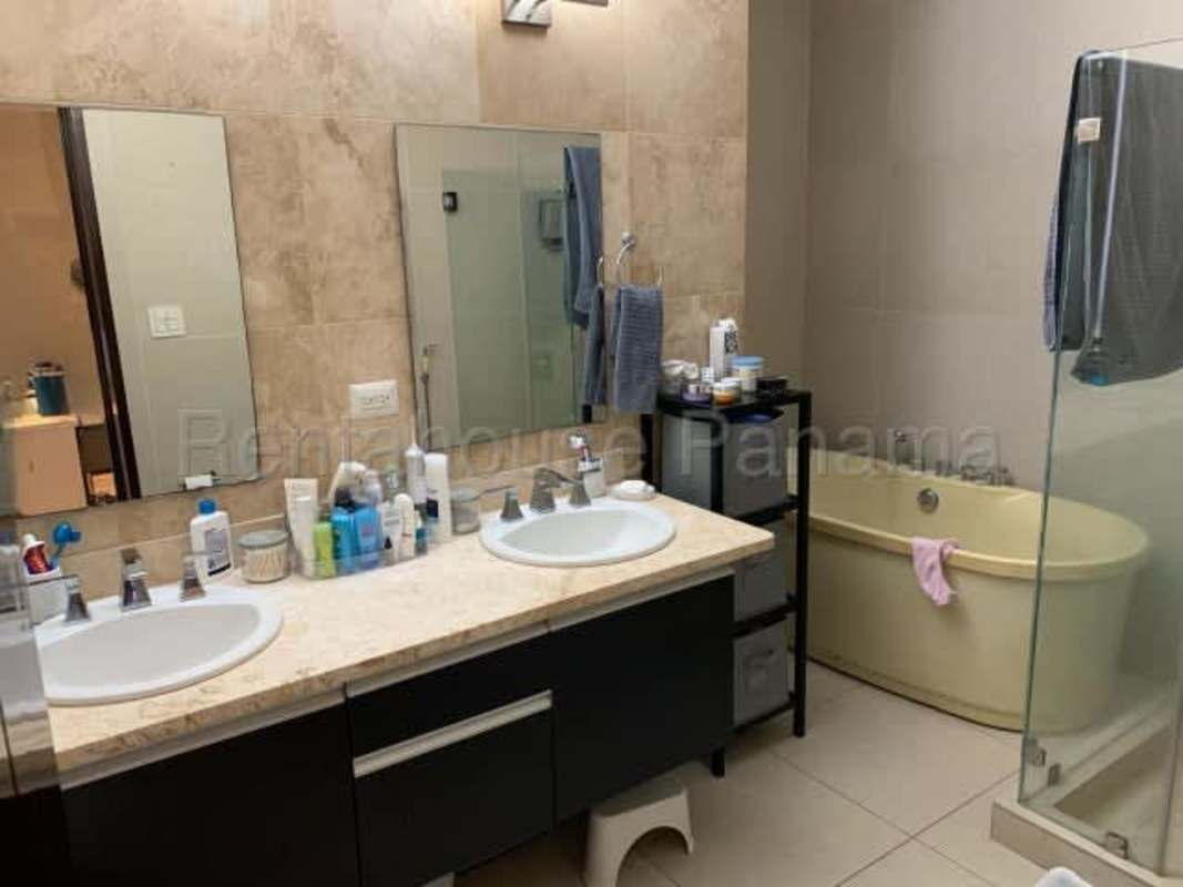 Modern bathroom with glass shower and marble tiling in PH Rivage Tower Apartment Panama