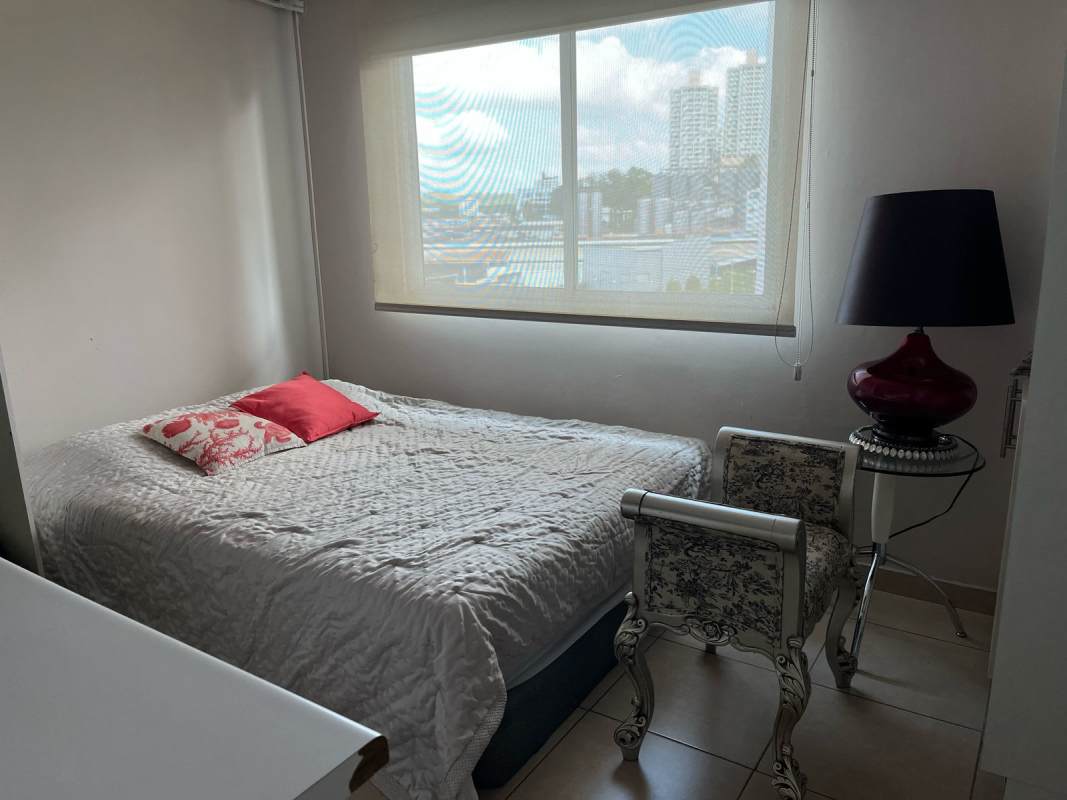 Cozy bedroom with bright window, furniture included in rental apartment Panama