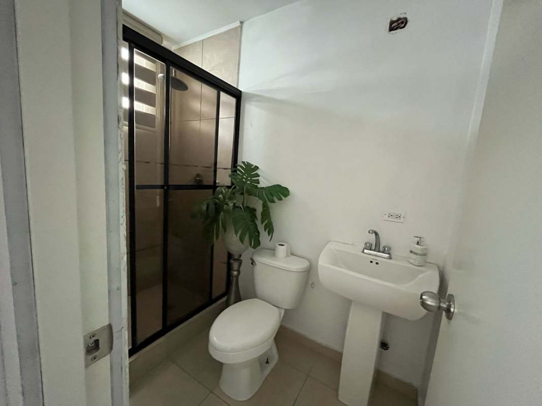 Updated bathroom with glass shower enclosure, PH El Cangrejo Plaza apartment