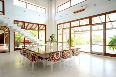 Contemporary bedroom with wood accents, ensuite bathroom in beachfront villa Pedasi Panama