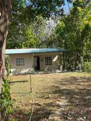 Bright living room with ceramic tile floors and large windows countryside house in Montijo Panama
