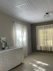 Bedroom with ceramic floor and secure window in remodeled country house Montijo Panama