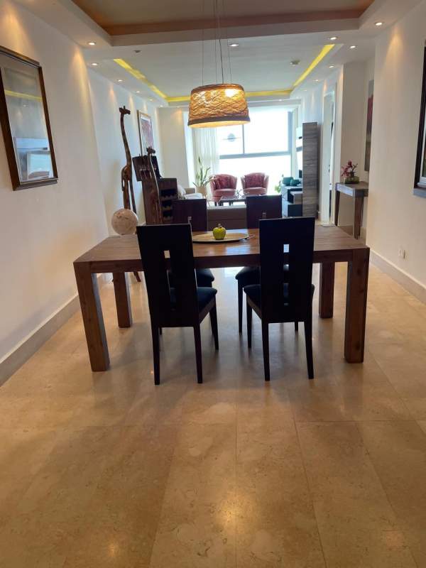 Bedroom with floor-to-ceiling glass, ocean-facing balcony and designer decor at Yoo Panama