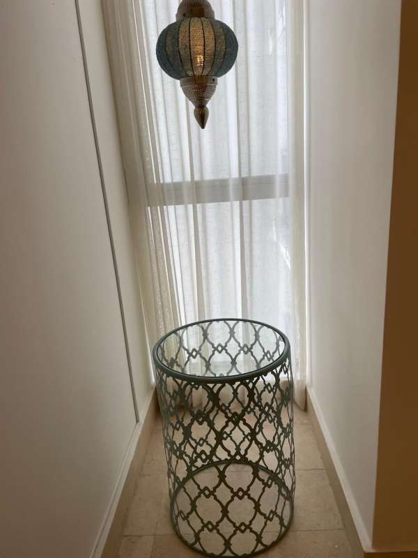 Open concept dining and living room with ocean views in Yoo Panama apartment