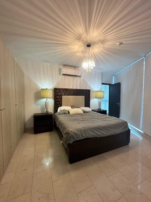 Bright furnished bedroom with ocean view and walk-in closet PH Grand Tower Punta Pacífica Panama