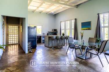 Bright kitchen with concrete countertops, large windows in mountain retreat Potrerillos Boquete Panama
