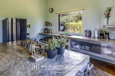 Covered infinity edge swimming pool overlooking jungle mountain retreat Potrerillos Boquete Panama