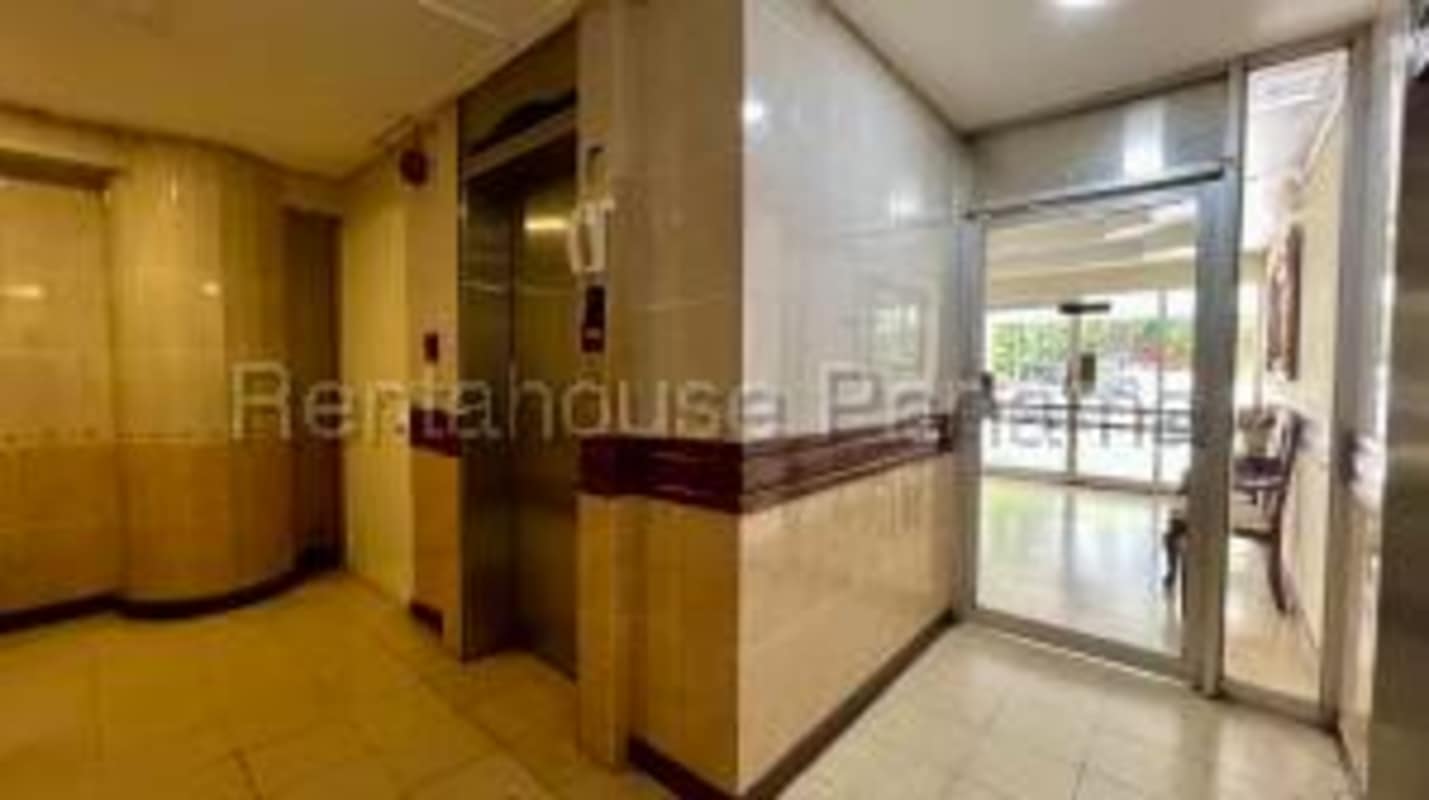 Dining room with large windows overlooking city skyline PH Plaza Paitilla Panama