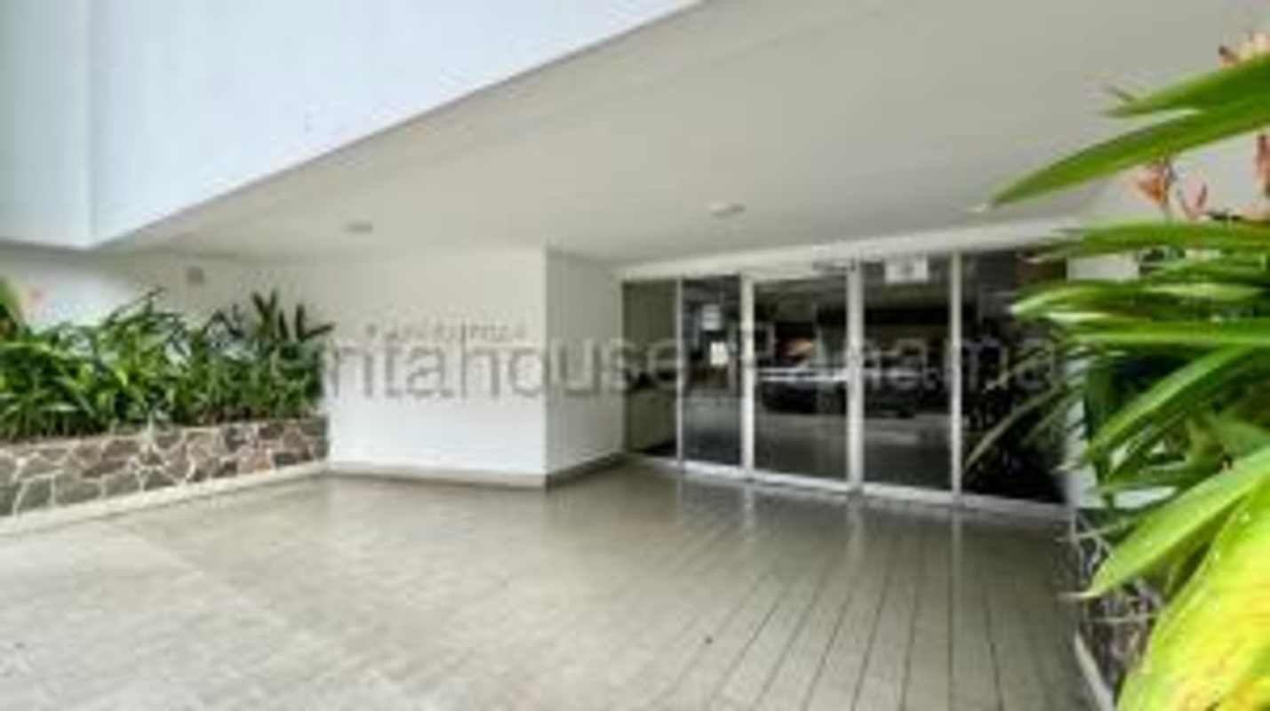 Bright bedroom with large window and skyline views at PH Plaza Paitilla Punta Paitilla