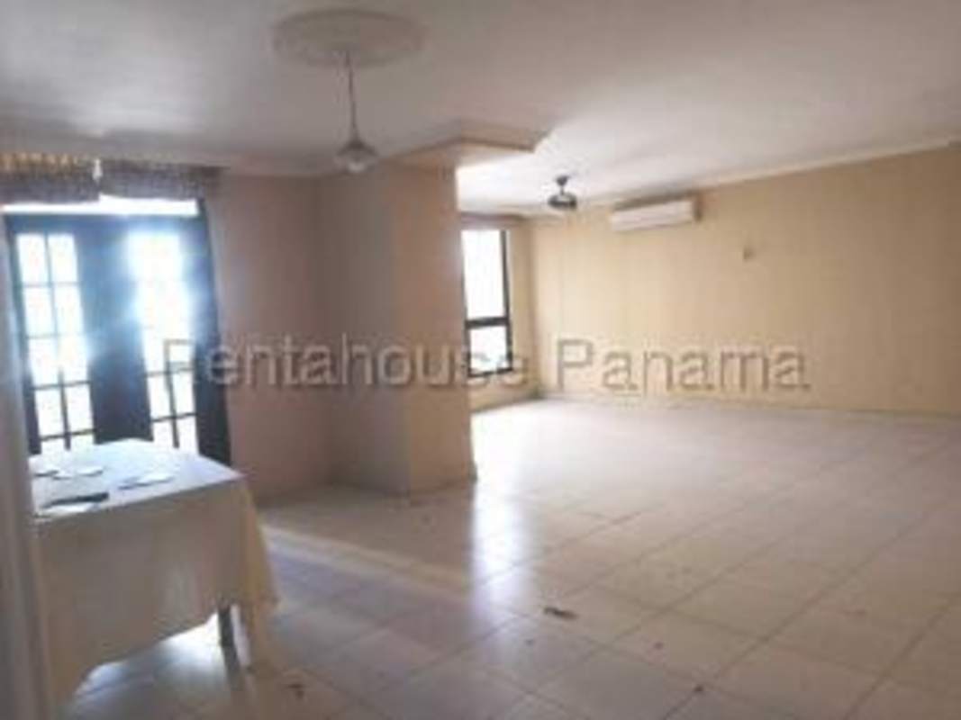 Traditional kitchen with wood cabinetry and tile flooring PH Courtyard View Punta Pacifica
