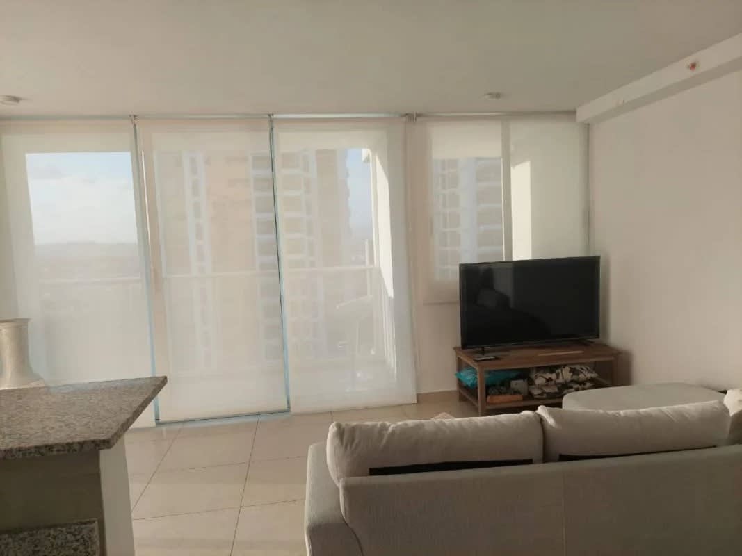 Spacious living room with large windows in PH Lumiere Tower 200 Panama City
