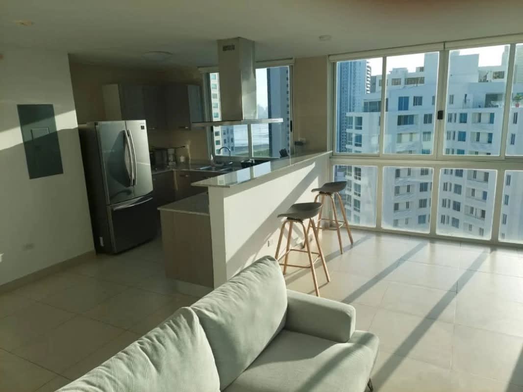 Living room and modern kitchen with panoramic windows in Costa del Este Panama
