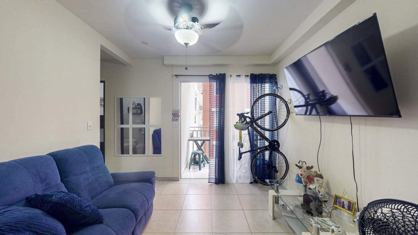 Cozy family room with TV and balcony access PH El Doral Hato Pintado Panama