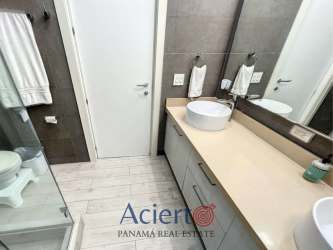 Bathroom with vessel sink glass shower and neutral tiles in PH Solea Punta Barco