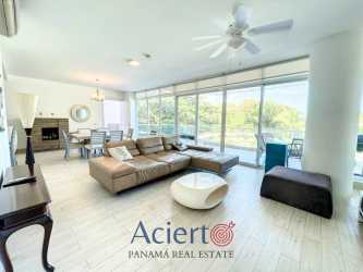 Spacious bright living and dining area with large windows and ocean view balcony Punta Barco Panama