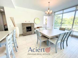 Contemporary kitchen with appliances and bar seating in Punta Barco beachfront condo Panama