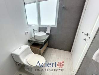 Elegant tiled bathroom with modern fixtures in PH Solea Punta Barco Panama