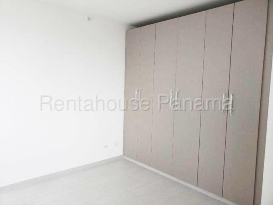 Modern bedroom with large window city views and built-in closet San Francisco Bay Panama