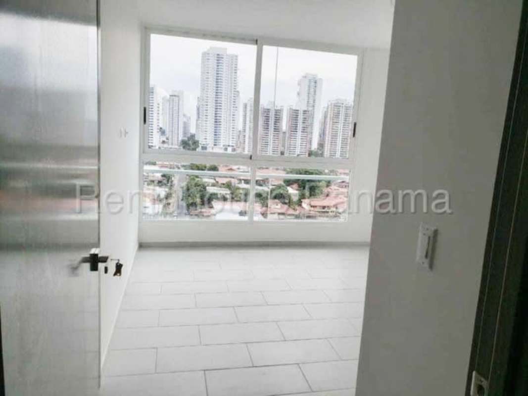 Open plan living and dining area with large windows in PH San Francisco Bay