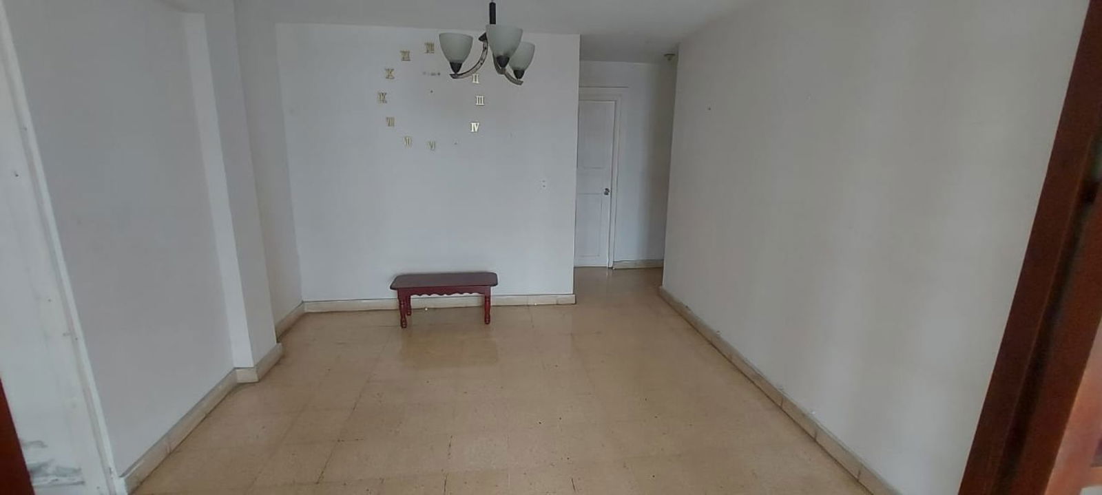 Living area with sliding glass doors, tile flooring at El Ingenio Panama City