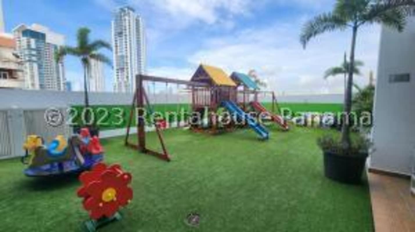 Contemporary kitchen with black granite countertop and white cabinets at PH Tee One Panama City