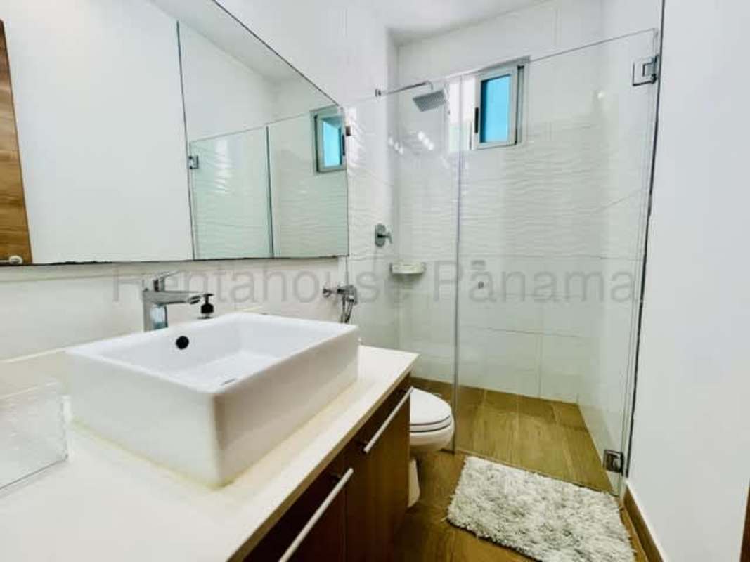 Spacious modern event room with large windows overlooking Panama City skyline at PH La Cresta Tower