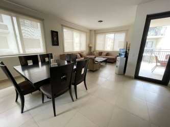 Modern living room with large windows and access to balcony in River Valley Panama Pacifico
