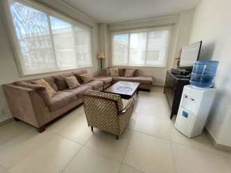 Modern bedroom with large bed and natural light in River Valley Panama Pacifico
