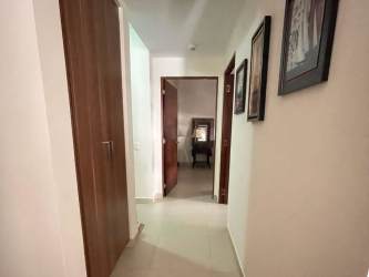 Modern apartment building in River Valley Panama Pacifico with balconies and green landscaping