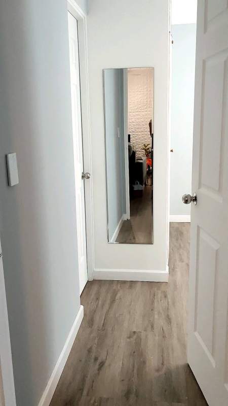Modern bathroom with tiled walls, sink vanity and mirror at PH Palma de Bella Vista Panama City