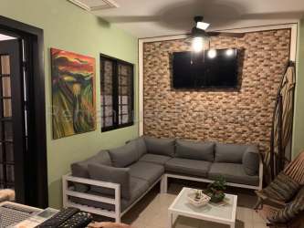 Comfortable living room with inverter AC and garden access in Panama Pacifico house