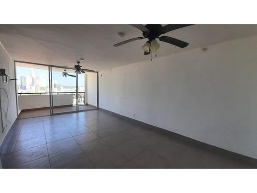 Spacious living room opening to balcony, tile flooring, ceiling fans in PH Parques del Carmen