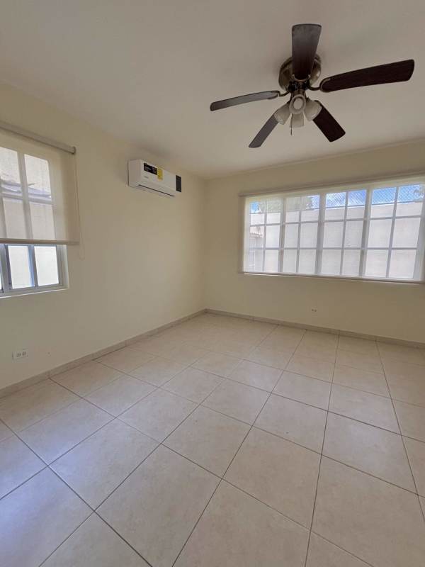 Covered terrace overlooking fenced yard in Residencial Clayton Panama