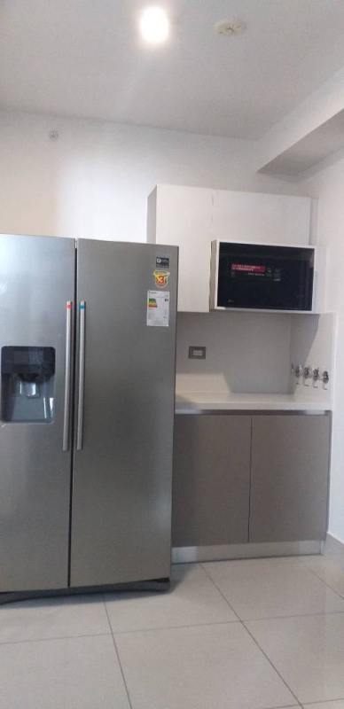 Designer furnished lobby with white sofas, glass tables, and art PH Bali Costa del Este Panama