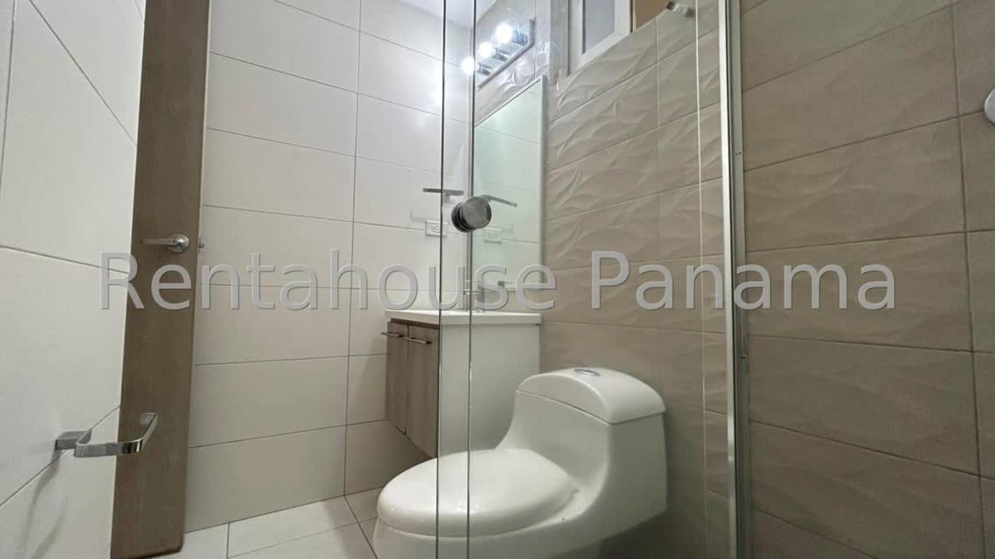 Outdoor playground with swings and slides in Costa Sur gated community