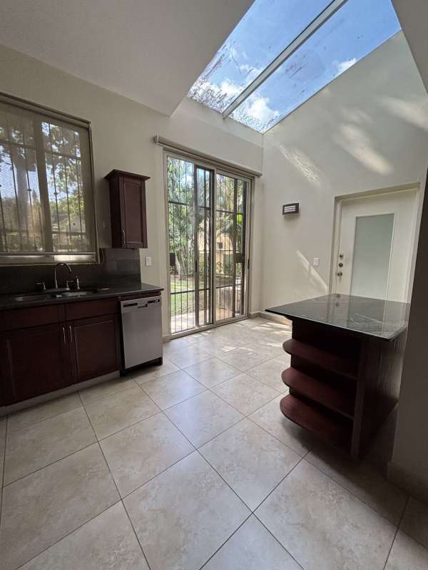 Dining room open layout ceramic tile floors Embassy Gardens Clayton Panama